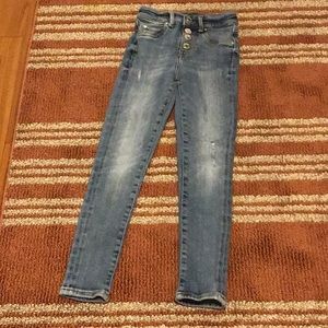 This is a pair of light washed jeans from guess size 7 four buttons